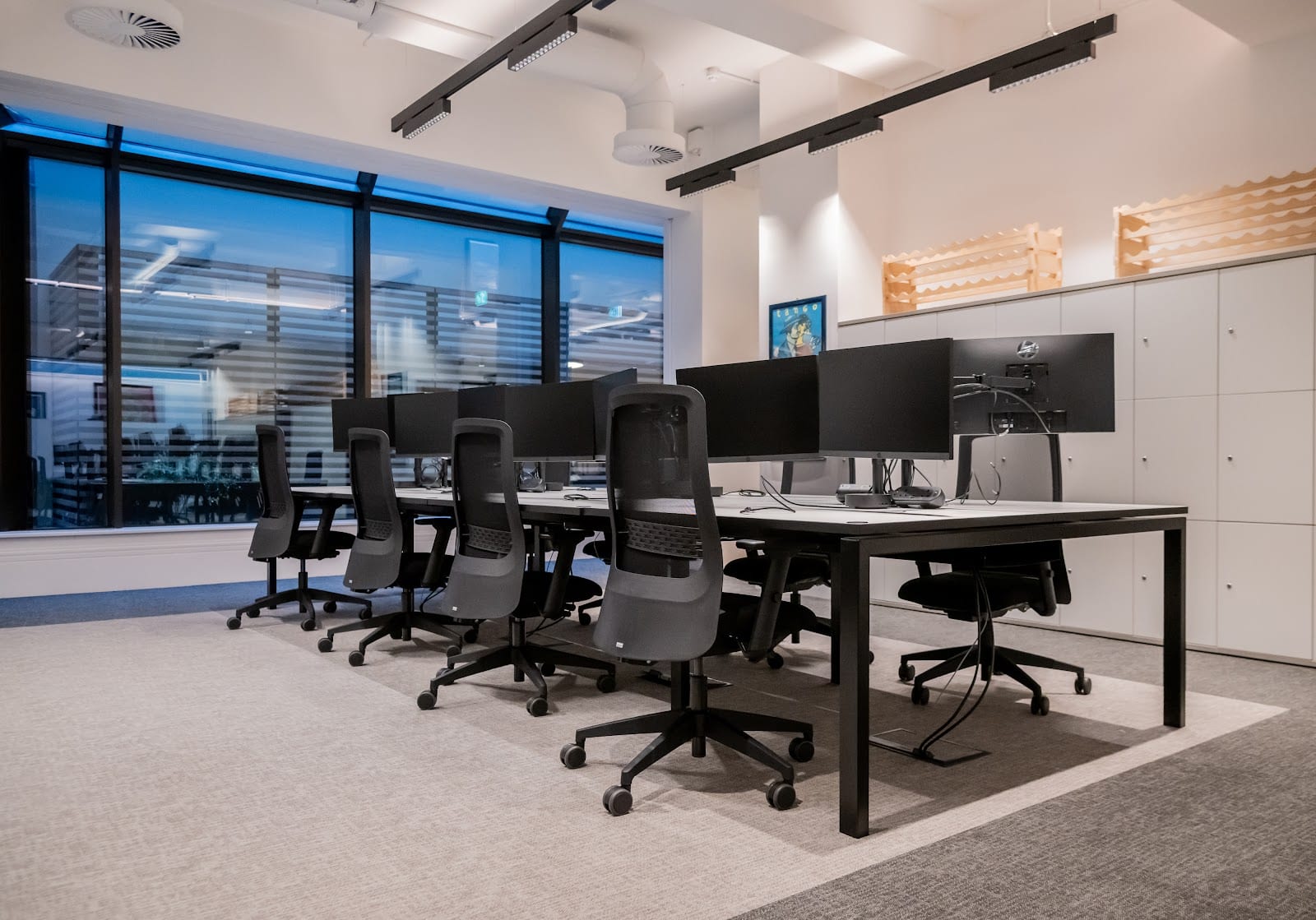 Completed Cat B workplace interior with modern workstations and architectural lighting